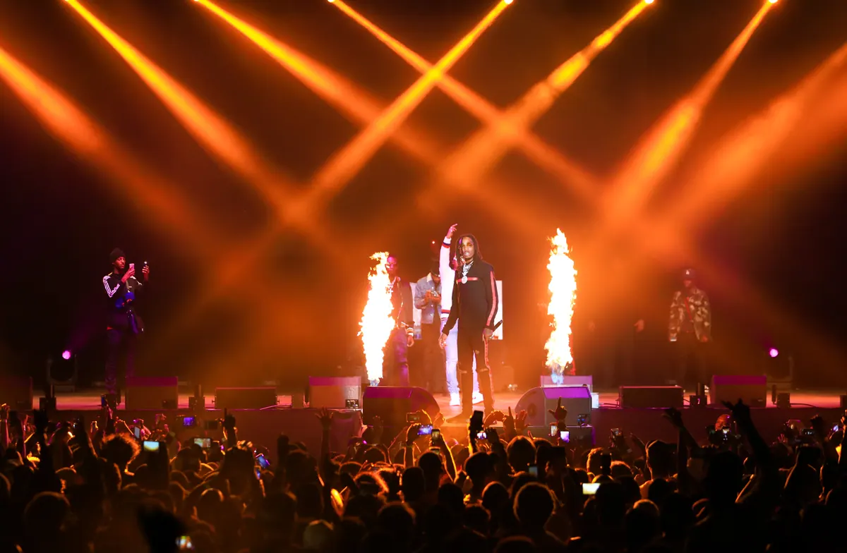 Migos on stage with pyrotechnics at the Culture Tour