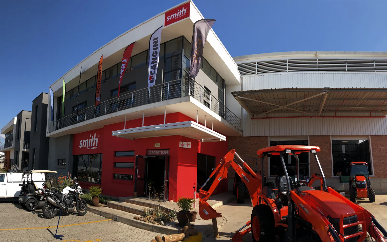 The Smith Power Equipment head office and warehouse, with two Kubota tractors parked out front